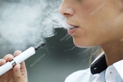 Closeup Of Woman Smoking Electronic Cigarette Outdoor Stock Photo By