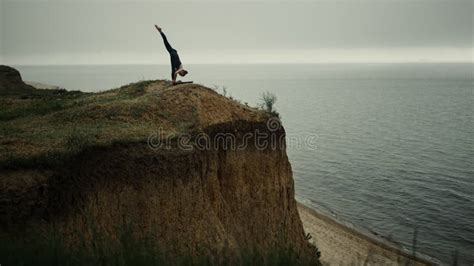 Beautiful Woman Bending Body To Foot Practicing Yoga Asana On Beach