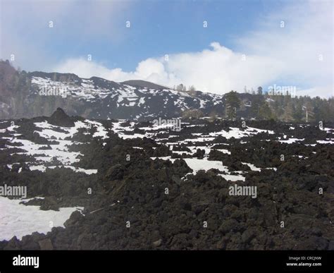 Lava Field With Snow At The North Of Mount Etna Italy Sicilia Stock
