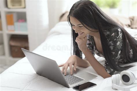 Woman Lying On Bed And Connecting With Her Laptop Stock Image Image Of Leisure Chatting