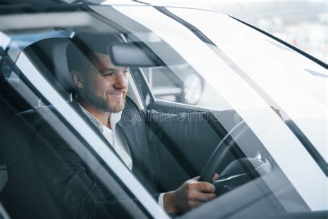 Friendly And Positive Person Modern Businessman Trying His New Car In