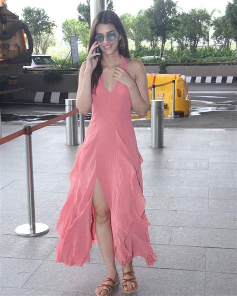 kriti sanon in a thigh high slit maxi dress at airport