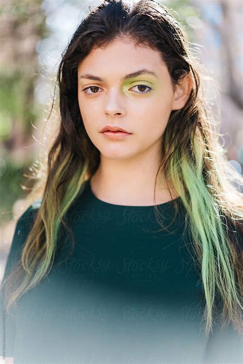 beautiful girl with dyed hair and green eyeshadow by stocksy contributor javier díez stocksy