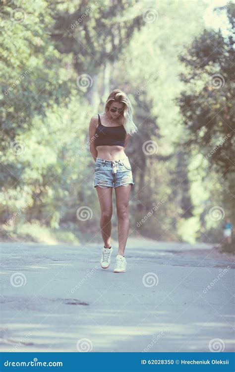 Beautiful Girl Walking Down A Forest Road Stock Photo Image Of