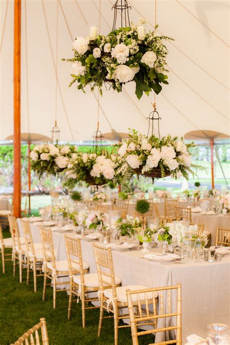 Floral Chandeliers Full Of White Peonies Roses And Spirea Were Hung