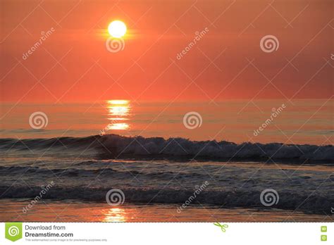 Peaceful Scene Of Early Morning Sunrise At The Beach Stock Photo