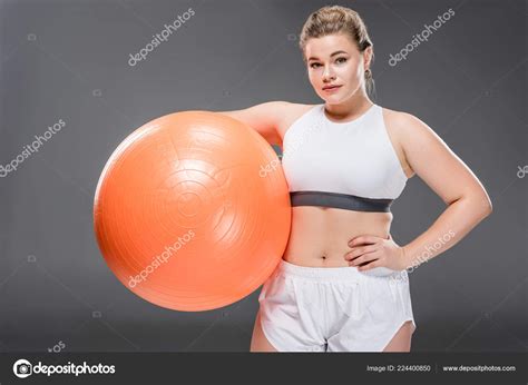 Young Overweight Woman Sportswear Holding Fit Ball Looking Camera