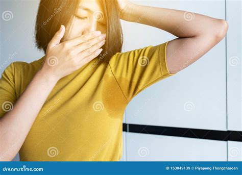 Asian Women With Odor Sweatingfemale Smelling Or Sniffing Her Armpit