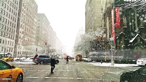Winter Snow Storm In New York City Walking Across The Street On
