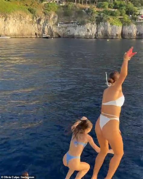 Olivia Culpo Puts Her Washboard Abs On Display In A White Bikini While Vacationing In Greece