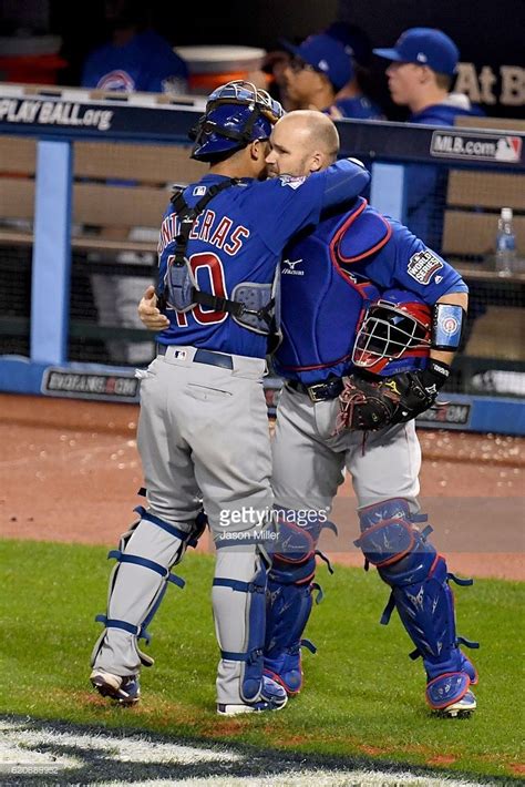 Willson Contreras Of The Chicago Cubs Hugs Teammate David Ross During