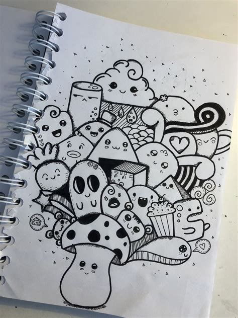 A Notebook With Some Doodles On It And An Image Of Cupcakes In The Middle