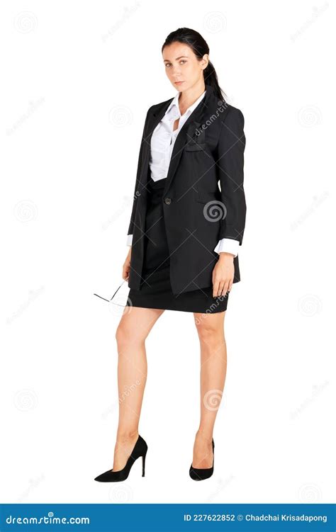 Business Women In Black Suits Hold Glasses In A Hip Position While Looking Ahead Portrait On