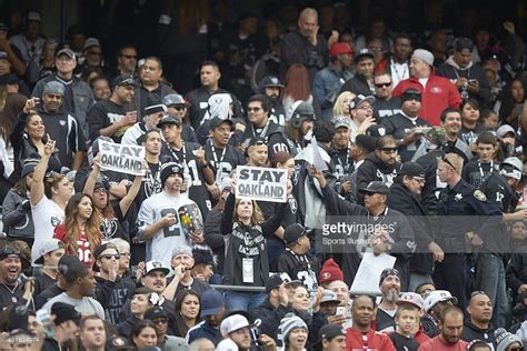 Oakland Raiders Fans With Stay In Oakland Signs In Stands During Game