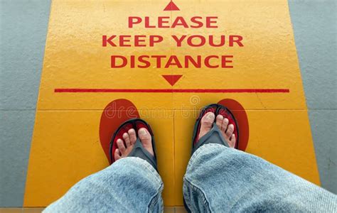 Please Keep Your Distance Sign On A Floor Stock Photo Image Of