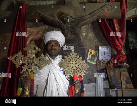 Portrait Of An Ethiopian Orthodox Priest Holding Crosses Inside Asheten
