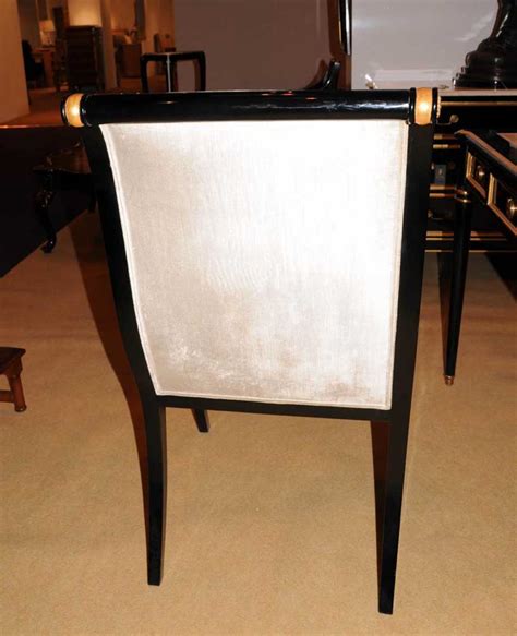 Instead of the usual work setup with an ergonomic rolling chair, large desk, and organizers of every kind, you're working with a kitchen table and chair setup that contribute to a longer and less enjoyable workday. Regency Black Lacquer Writing Desk Chair Set