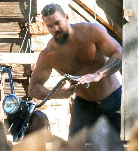 Jason Momoa Goes Shirtless While Working On Motorcycle Photo