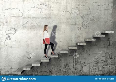 Side View Of Young Businesswoman Climbing The Stairs With Business