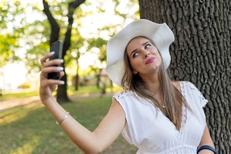 Premium Photo Young Traveler Woman Making Selfie During Abroad Trip