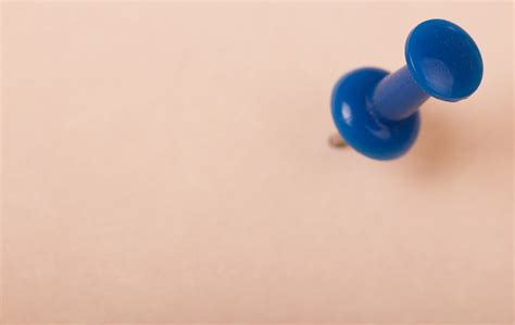 Blue Pushpin In The White Paper Stock Photo Download Image Now