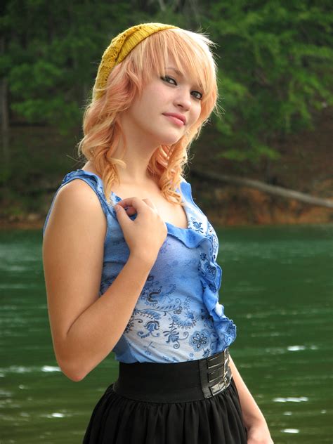 Free Photo A Beautiful Young Woman Posing By A Lake Beautiful Cute