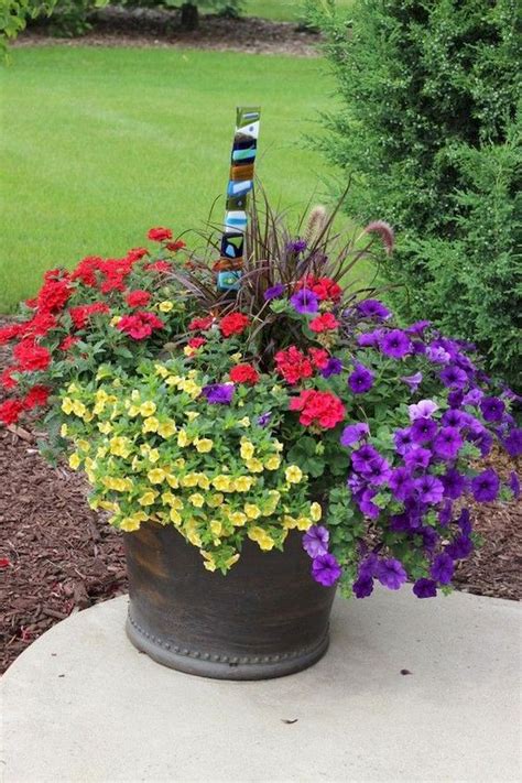 Purple butterfly bush, purple salvia, and a white climbing rose stand out in this tidy summer border. 55 Fresh and Beautiful Summer Container Garden Flowers ...