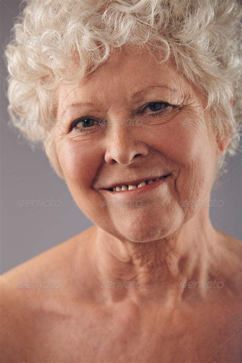 Attractive Senior Woman Face With A Sweet Smile Stock Photo By Jacoblund