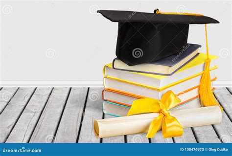 Graduation Hat On Stack Of Book And Diploma Stock Image Image Of