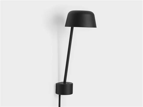 The lamp has a slender design that leans outward, away from the wall and into the room. Buy the Muuto Lean Wall Light at Nest.co.uk