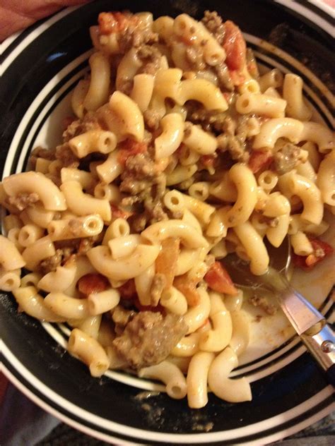 Top with slices of velveeta cheese. 1 lb. hamburger mix with a box of velveeta Mac n cheese add can of rotel tomatoes and 1/4 cup of ...