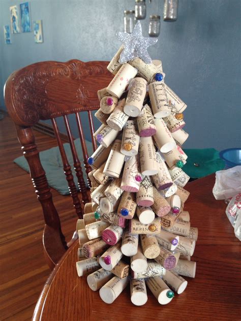 A Christmas Tree Made Out Of Wine Corks Sitting On Top Of A Wooden Table
