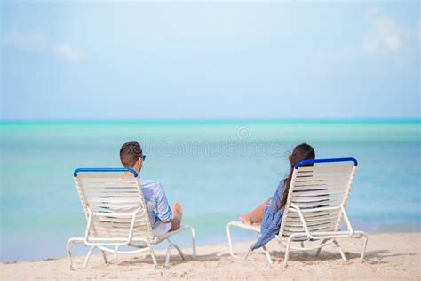 Couple Relax On A Tropical Beach At Maldives Stock Photo Image Of