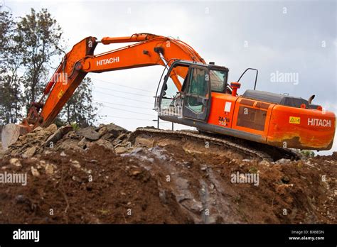 Excavator Or Digger Heavy Equipment Working On Highway Construction In
