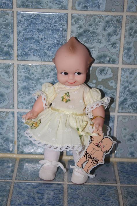 Vintage Kewpie Doll With Yellow Floral Dress By Jesco