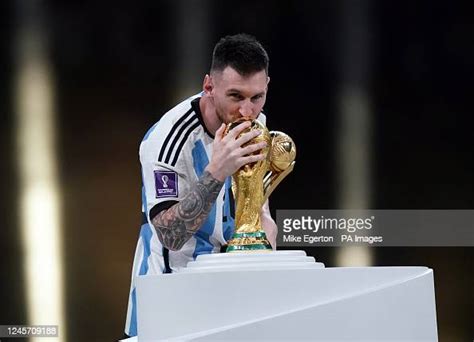 Argentinas Lionel Messi Kisses The Fifa World Cup Trophy After Being