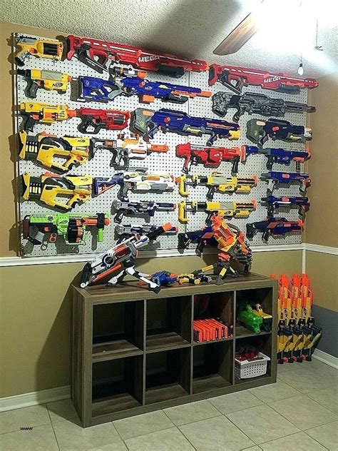 Keeping nerf guns and ammo on racks or in storage containers is a great way to organize your nerf guns and avoid losing your darts. Pin on TOY ORGANIZATION