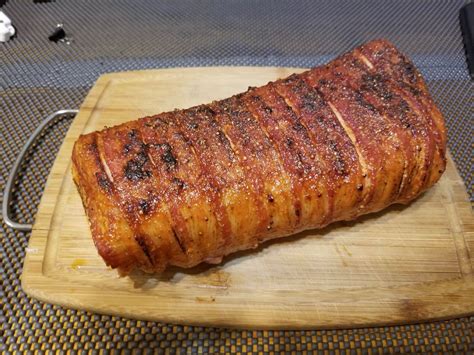 I cooked a 4.5 pound pork sirloin pork roast at 400 degrees fahrenheit for an hour, then turned the temperature down to 375 degrees fahrenheit for two more hours. Sous Vide Bacon Wrapped Pork Loin