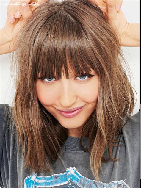 Layered long wavy hairstyle with side swept bangs. 12 Medium Length Hairstyles With Fringe - Undercut Hairstyle