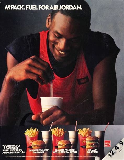 An Ad For Mcdonald S With A Man Holding A Drink And Fries In Front Of Him