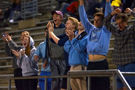 The Small Crowd Of Soccer Fans Cheer With Excitement After East Scores
