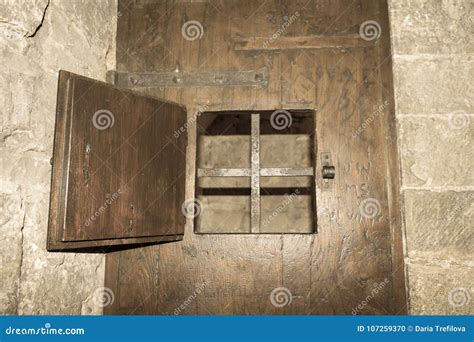 An Open Window With Iron Grid Of An Ancient Door Of A Prison Or A