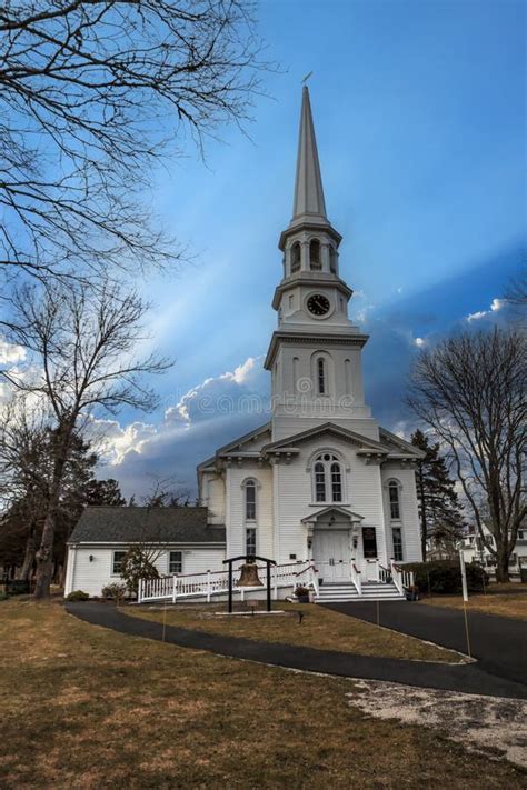 Sunlight Through Clouds Over The First Congregational Church Of Chatham