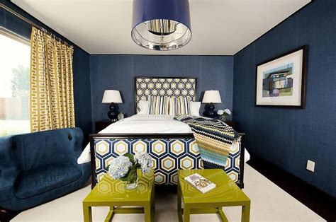 Yellow And Blue Bedroom Features Walls Clad In Navy