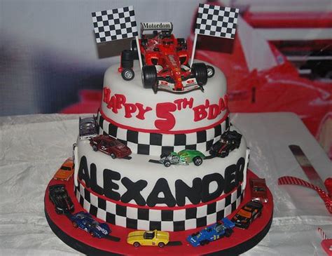 Any one of these parties would be a great place to start. 2 tier race car theme birthday cake for 5 year old.JPG