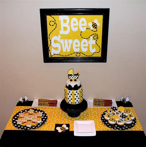 Bunches of sunflowers serve as visually appealing borders at the top and bottom of the page. 31 Bee Themed Baby Shower Decorations | Table Decorating Ideas