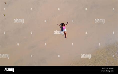 Top Aerial View Of A Woman Lying On A Tropical Beach Sand Stock Photo Alamy