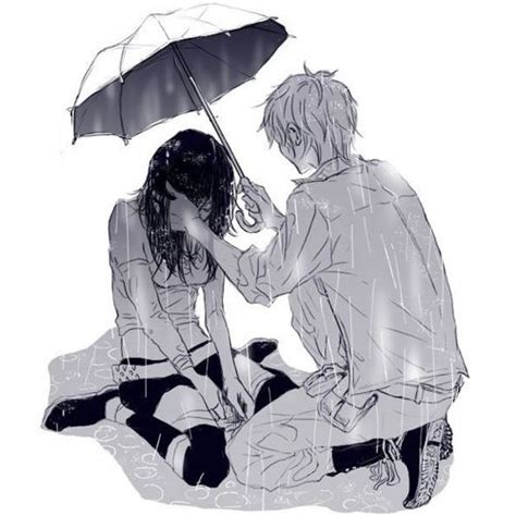 Two People Sitting On The Ground Under An Umbrella With One Holding