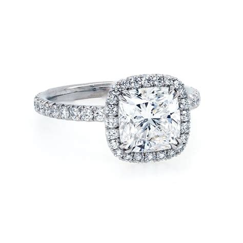 A modern style for a classic romance, this diamond engagement ring features an elongated cushion cut diamond. Cushion Cut Diamond Halo Engagement Ring - Halo Style Engagement Rings - Engagement Rings