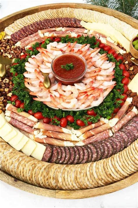 Or, you could place the sauce in a wine or martini cup with the shrimp around the rim for an elegant dinner. Epic Shrimp Cocktail Charcuterie Board #charcuterieboard # ...